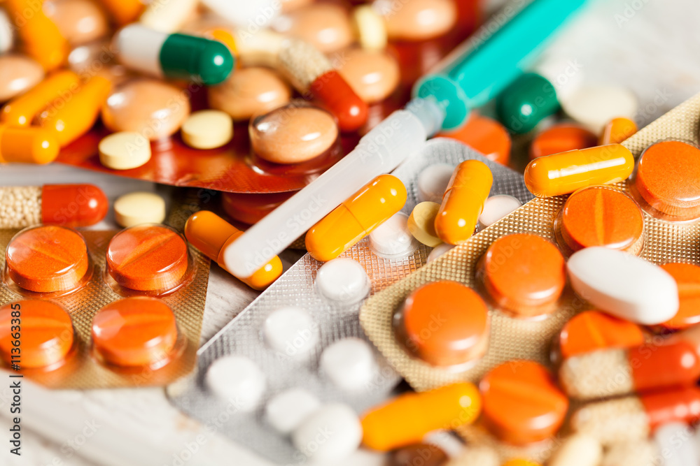 Bunch of colorful pills with blurred background Bunch of colorful pills with blurred background