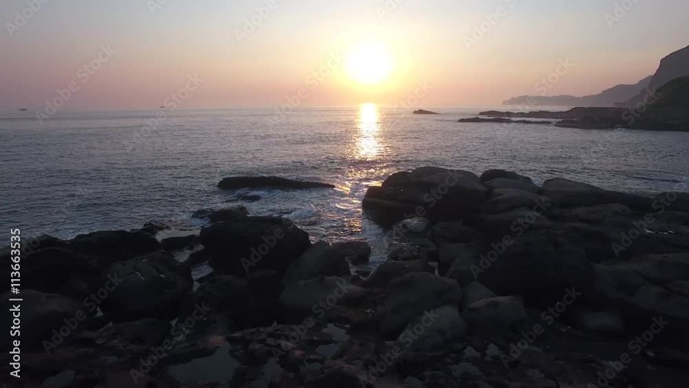 Beautiful Sunset crashing waves over large rocks on cosat of Taiwan Aerial Shot Beautiful Sunset crashing waves over large rocks on cosat of Taiwan Aerial Shot