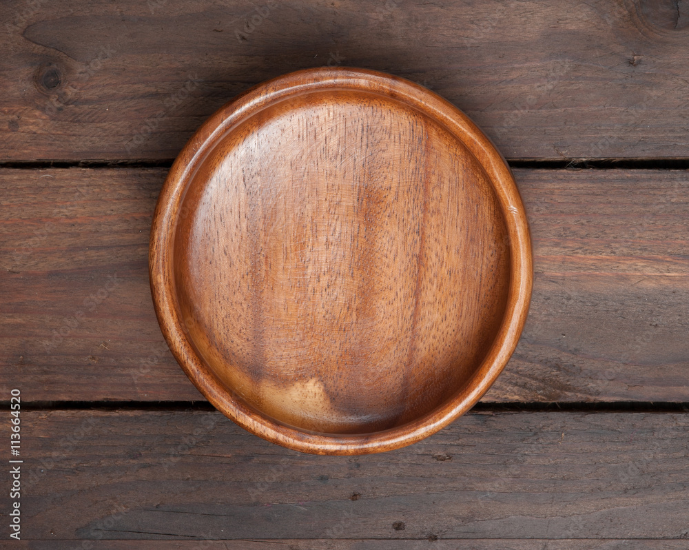 wooden bowl on wooden background,Top view wooden bowl on wooden background,Top view