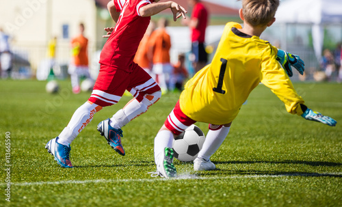Children Playing Soccer Football Match. Youth Soccer Forward and Goalkeeper Duel