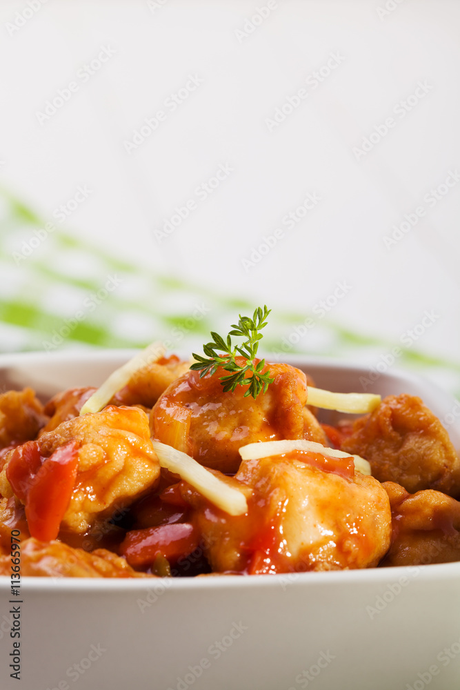 Fried chicken pieces in batter with sweet and sour sauce Fried chicken pieces in batter with sweet and sour sauce