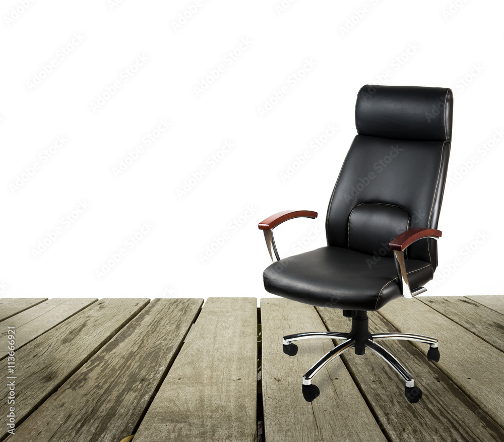 Black leather office chair on wood floor over white background Black leather office chair on wood floor over white background