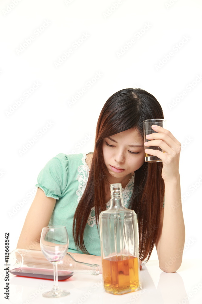 Japanese woman wearing a green summer dress drunk too much Japanese woman wearing a green summer dress drunk too much
