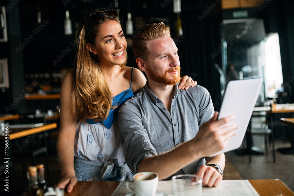 Beautiful couple looking at tablet Beautiful couple looking at tablet