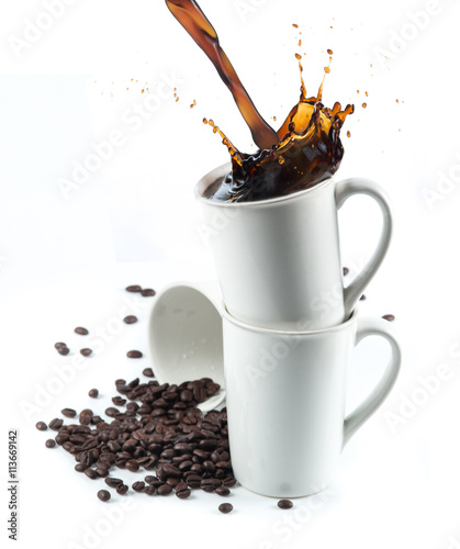 Coffee splash with Stacked white coffee cups isolated on white b