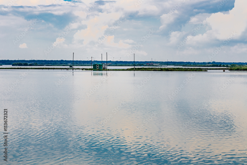 fishing hut in the quiet of brackish lagoon