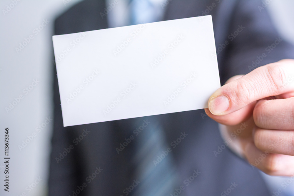 businessman holding white blank paper businessman holding white blank paper