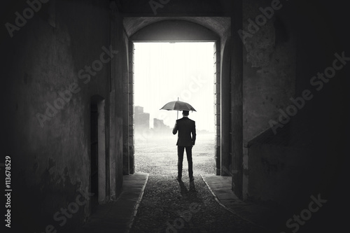 Business Man with umbrella waiting stop raining