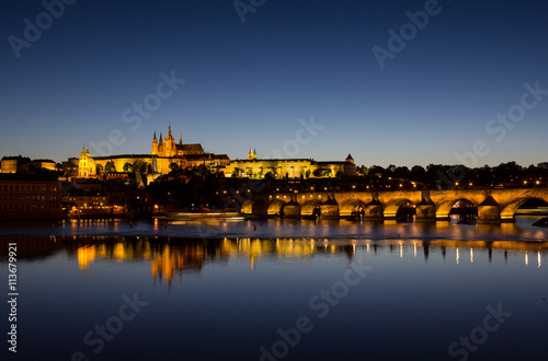 View To Hradschin Castle, St. Vitus Cathedral And Charles Bridge In Prague By Night 