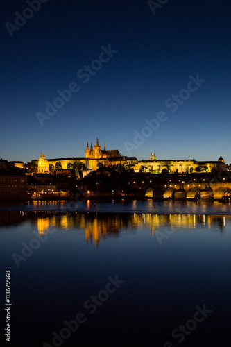 View To Hradschin Castle, St. Vitus Cathedral And Charles Bridge In Prague By Night 