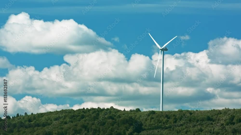 View of Wind Turbines with Mountains in the Background View of Wind Turbines with Mountains in the Background