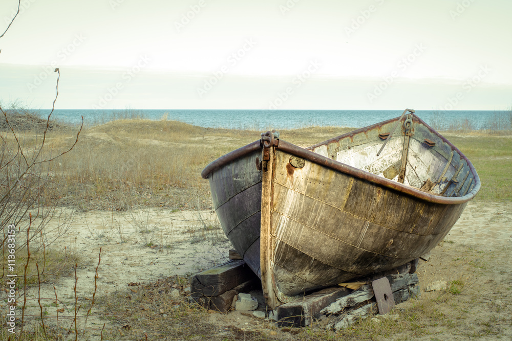 Rusty Boat On The Shore. Rusted boat on the remote coast of Lake Huron. Rusty Boat On The Shore. Rusted boat on the remote coast of Lake Huron.