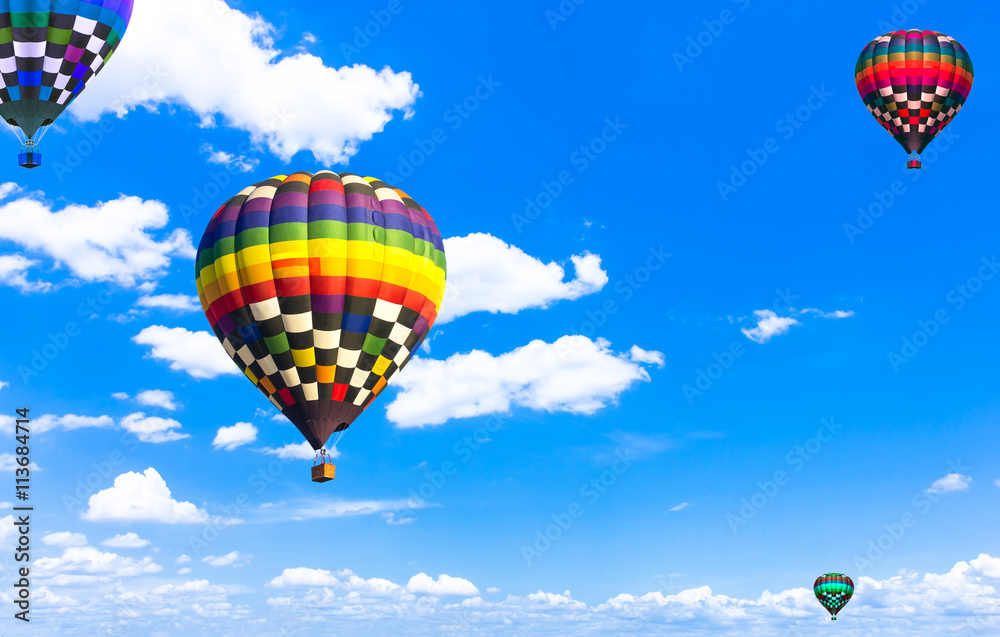 Fototapeta premium balloon Beautiful colorful hot air balloon flying in the vast sk