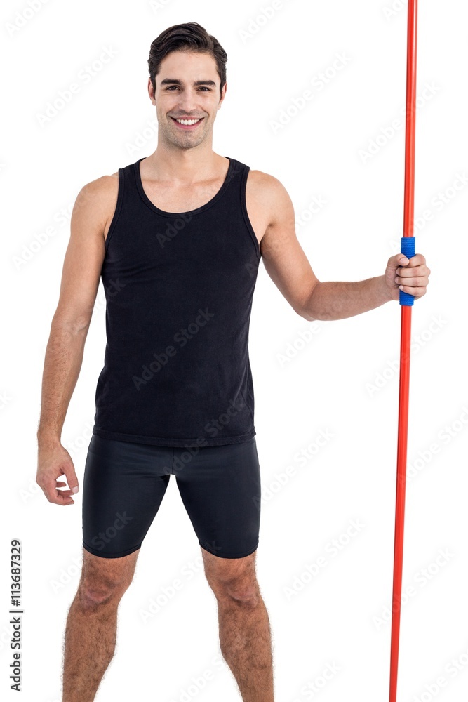 Portrait of happy male athlete holding javelin Portrait of happy male athlete holding javelin
