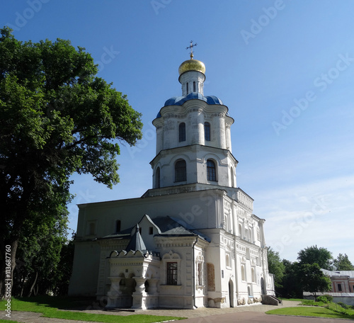 Old Christian temple with golden dome in the city park 