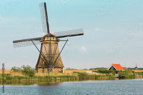 Traditional Dutch windmills with green grass in the foreground, The Netherlands