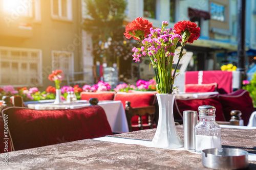Outdoor summer cafe tables with beautiful flower,europe restaura