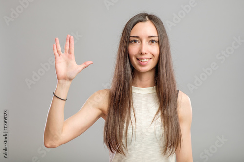 Girl showing Vulcan greeting