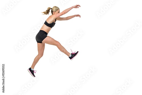 Athletic woman exercising on white background