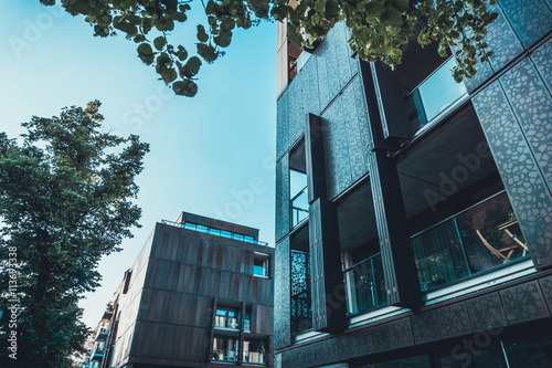 Unusual textured facade of a black townhouse photo