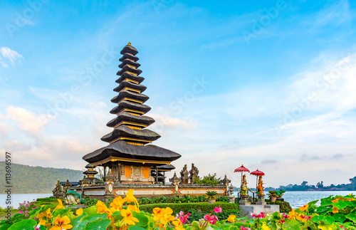 Hindu temple in the mountains of Bali, (Pura Ulun Danu Batur) is a popular tourist destination with hundreds of visitors each day. Here it is shown at sunrise on a beautiful day.