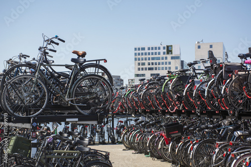 Canvas Print Bike parking in Amsterdam in the day under the blue sky