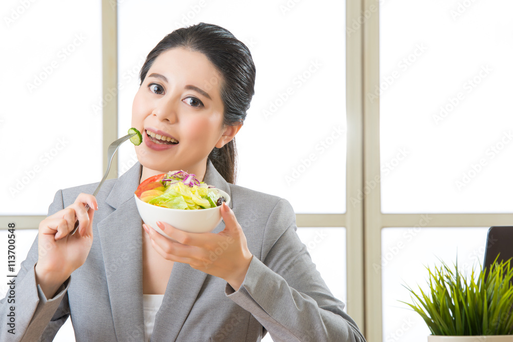 Young asian businesswoman enjoying a healthy salad Young asian businesswoman enjoying a healthy salad