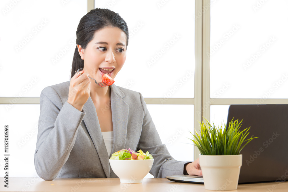 Young asian businesswoman enjoying a healthy salad Young asian businesswoman enjoying a healthy salad