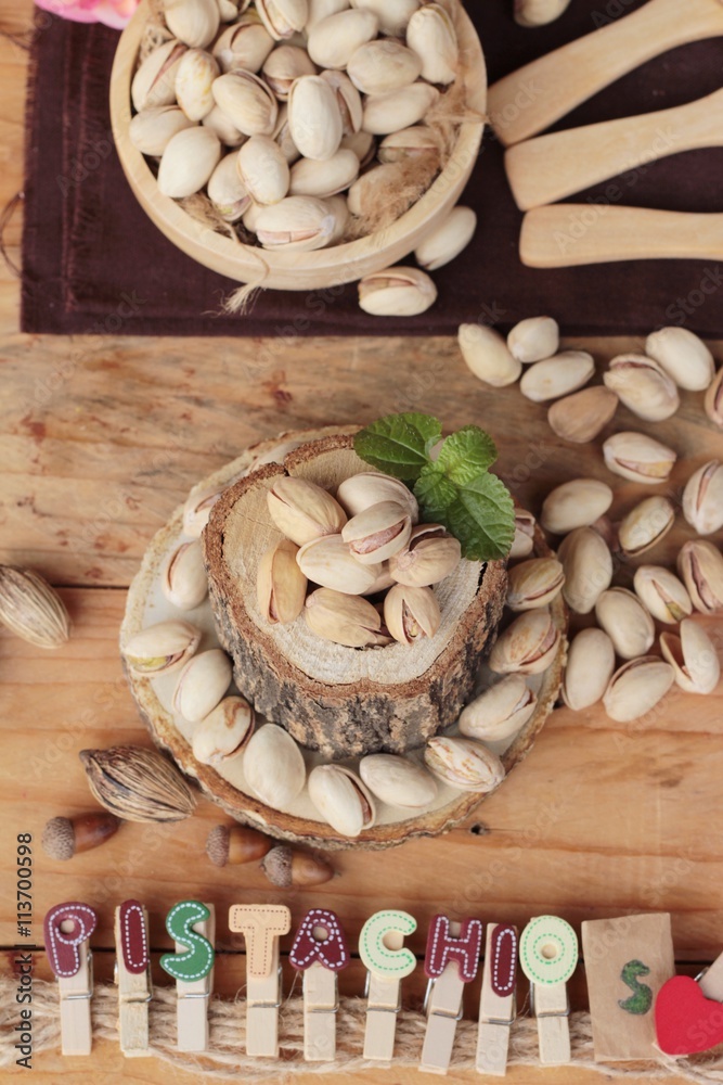 Fototapeta premium Pistachios is delicious for healthy on wood background.