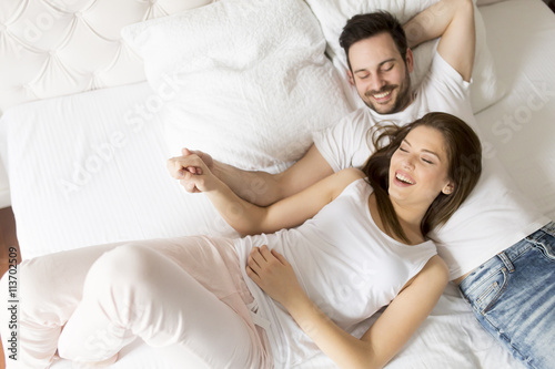 Young loving couple in the bed