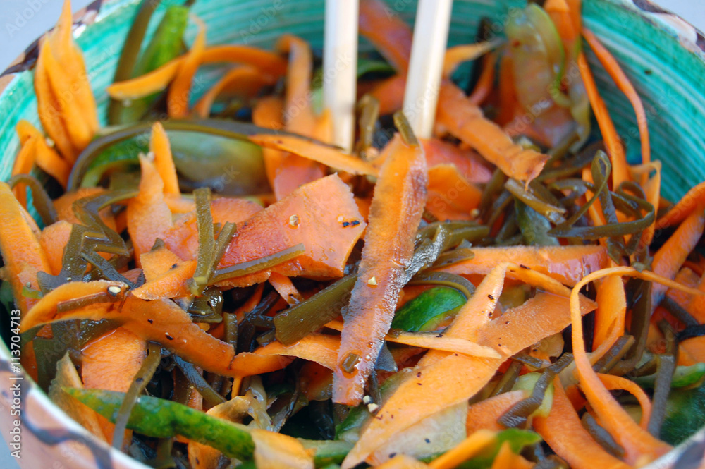 kelp noodles salad with carrot and cucumber, soy sauce ans wasab