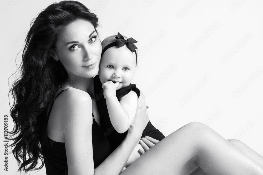 Fototapeta premium Young mother and her beautiful daughter