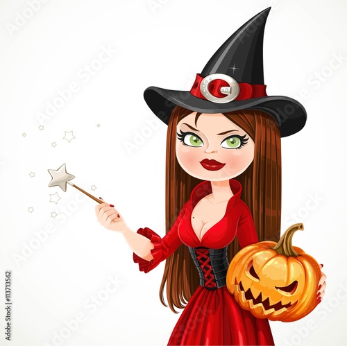 Beautiful witch in a red dress holding a pumpkin showing hand aside isolated on a white background