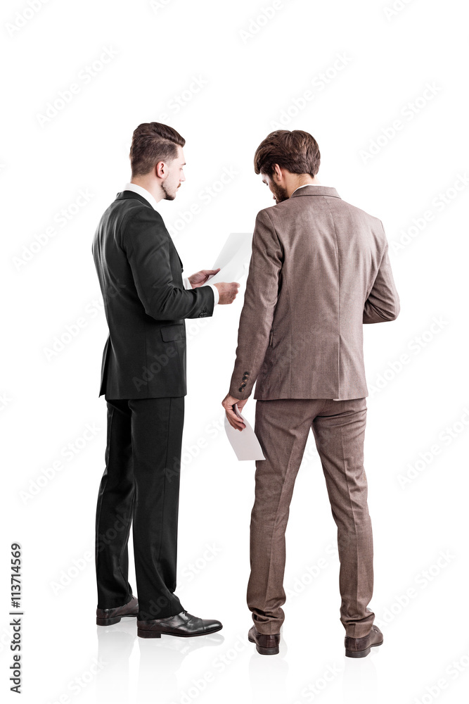 Businessmen discussing contract Businessmen discussing contract
