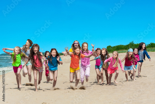 Happy children running on the beach