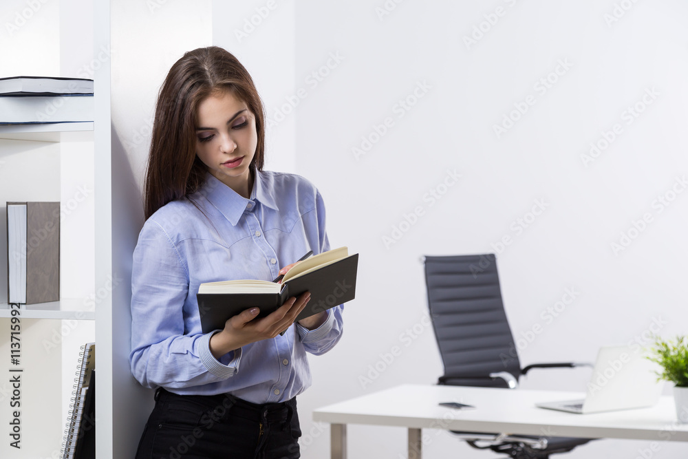 Attractive woman making notes Attractive woman making notes