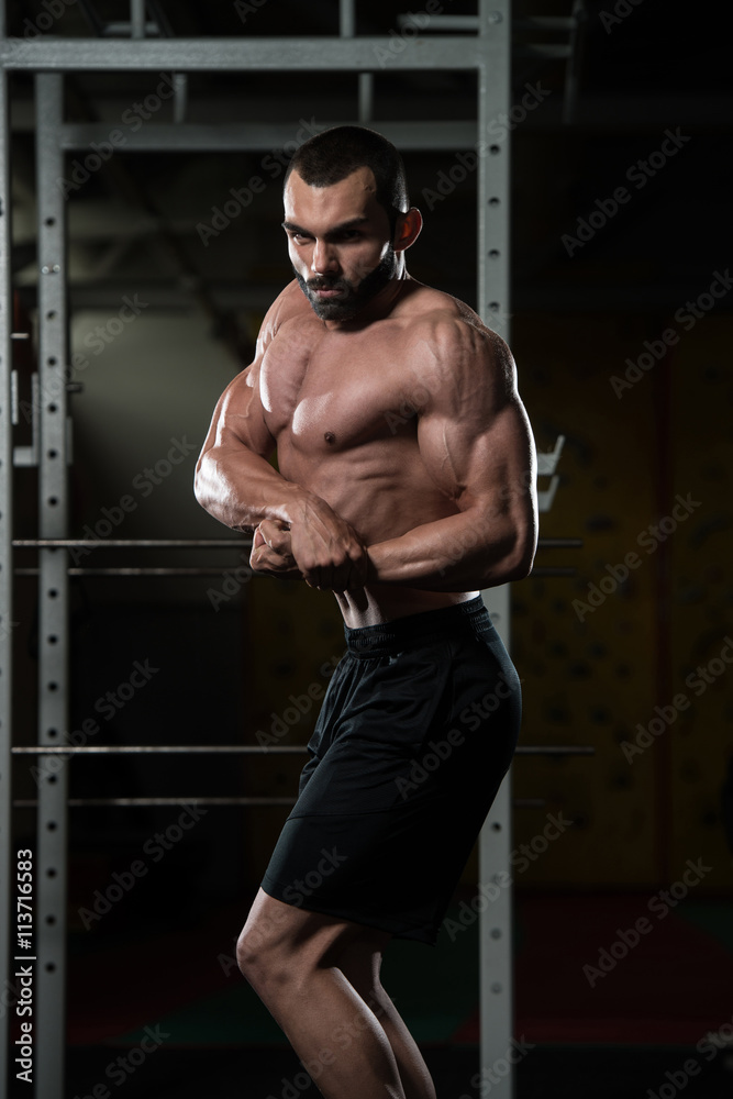 Young Bodybuilder Flexing Muscles Side Chest Pose Stock Photo
