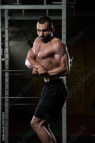 Young Bodybuilder Flexing Muscles Side Chest Pose