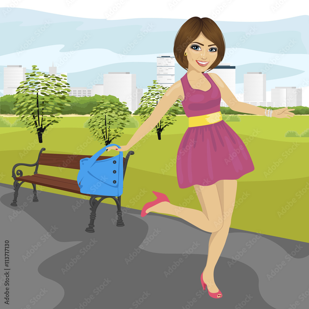 Φωτογραφία Young woman with handbag having fun running in summer park