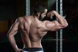 Muscular Man Flexing Muscles Biceps Pose