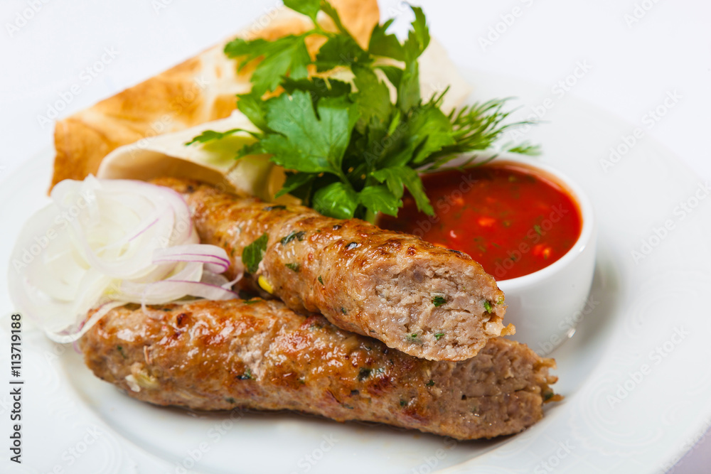 lyulya kebab with red sauce