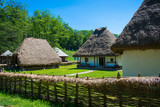 Old traditional wooden house with dry straw roof in Astra village, Sibiu