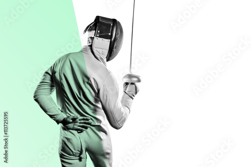Slika na platnu Man wearing fencing suit practicing with sword