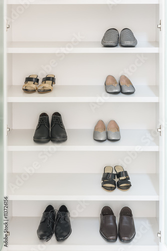 white wardrobe with male and female shoes