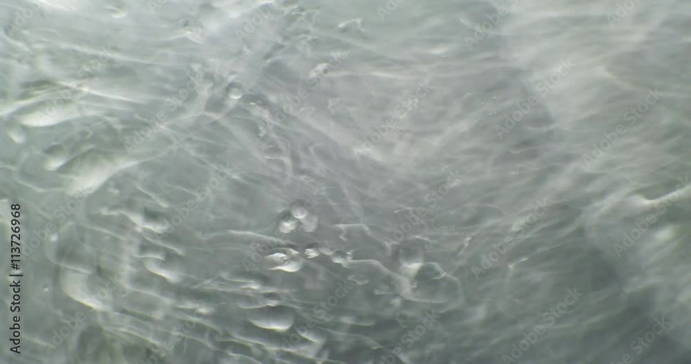 Macro. Oil babbles on water, abstraction video.
Macro. Oil babbles on water, abstraction video.