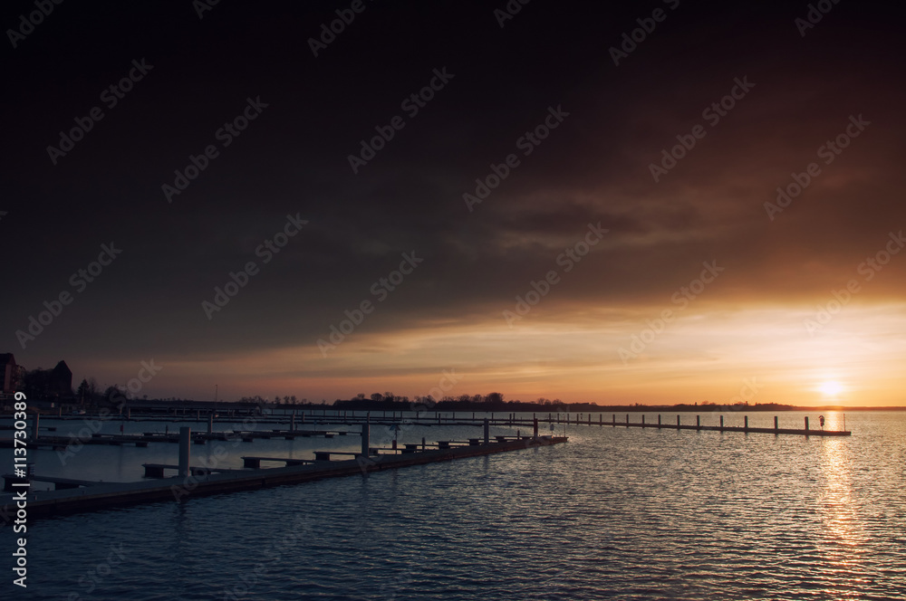 Harbor without ships at sunset