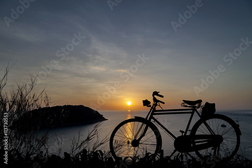 Silhouette Bicycle at sunset background © panya99