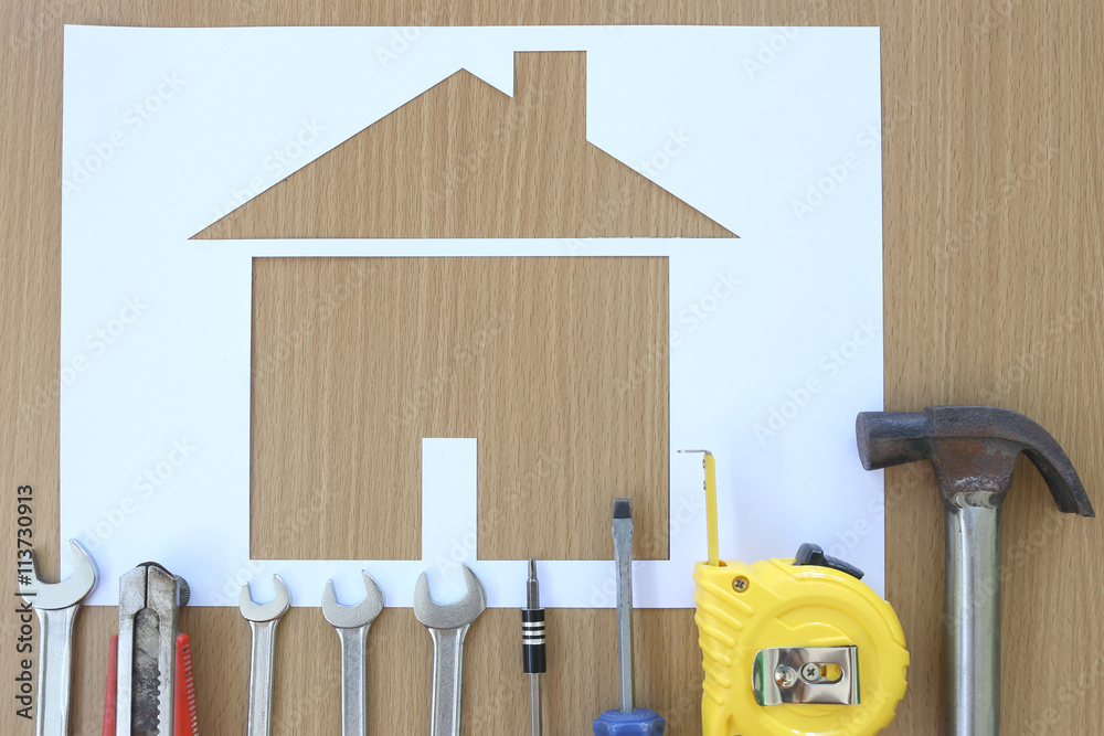 Six Paper Carpentry Paper shaped house on a background of brown wood and Craftsman t Stock ...