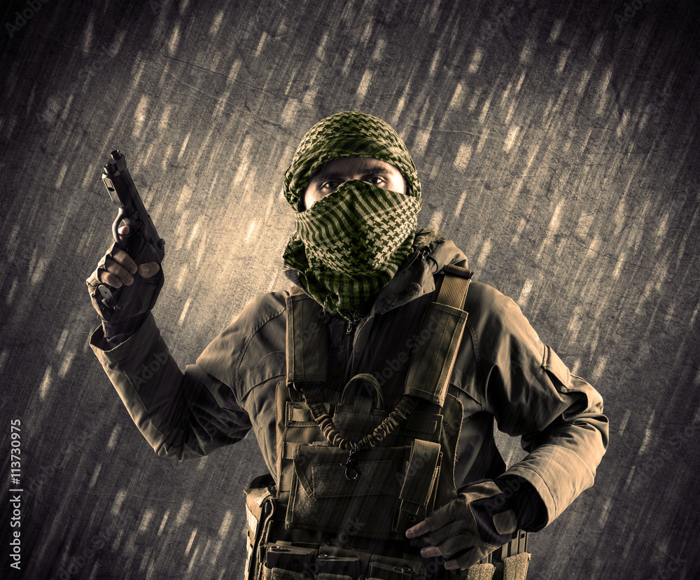 Armed terrorist man with mask on rainy background