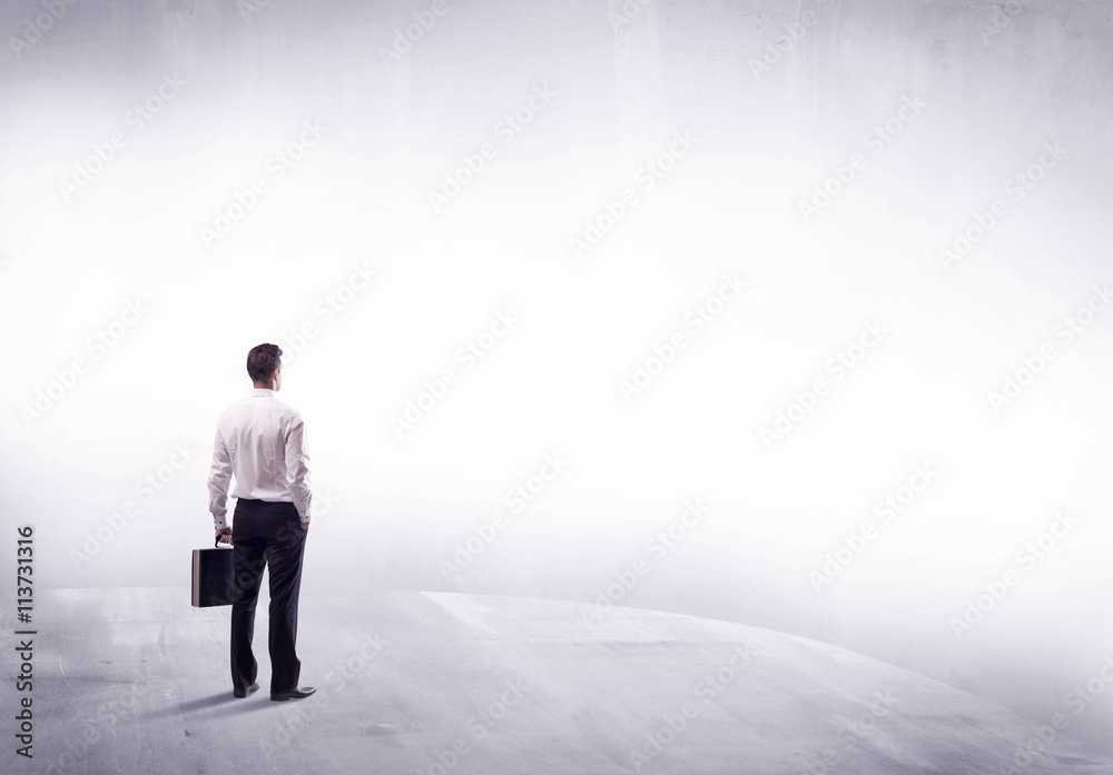 Business person standing from rear view Business person standing from rear view